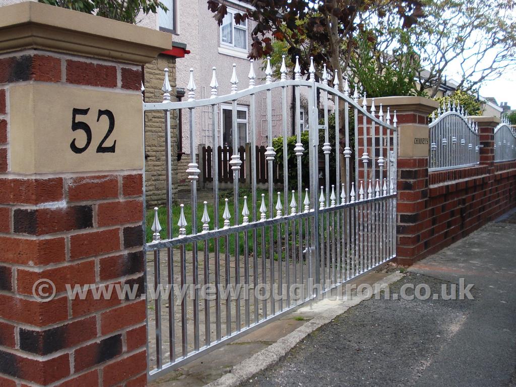 Photo - Double arch driveway gates with matching railings in galvanised finish, Fleetwood