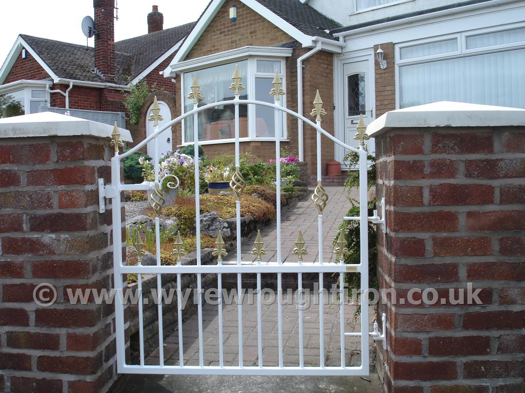 Single arch top gate, with railheads and cage twist. Galvanised, powder coated white and fitted in Poulton-le-Fylde.